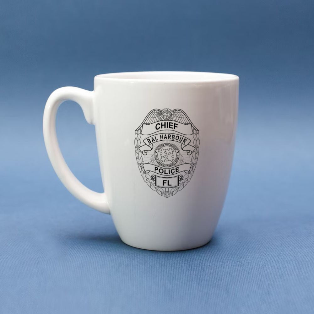 White mug with a black police badge design on a blue background
mug mockup
mug engraving 
police badge engraving