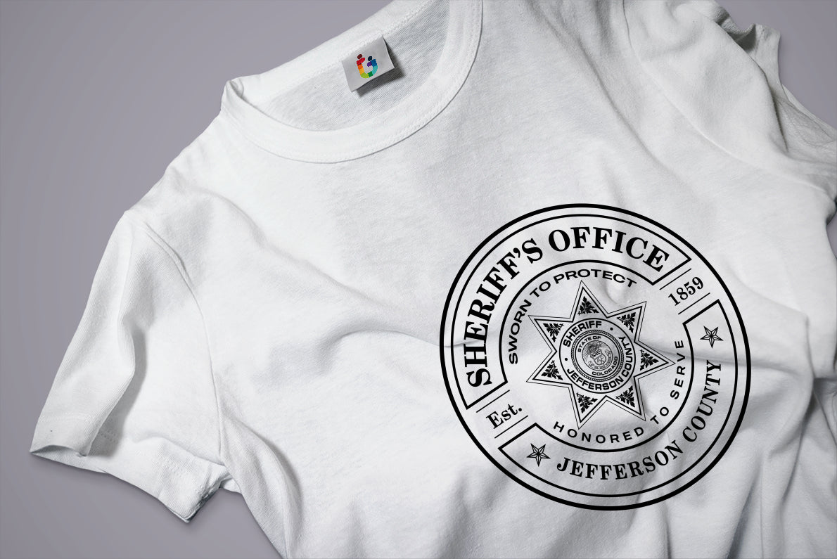 White t-shirt with a sheriff's office logo on a gray background
sheriff badge t-shirt print
mockup t-shirt