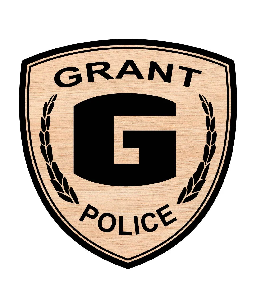 A shield-shaped wooden plaque or sign featuring a light natural wood grain background with black text reading 'GRANT POLICE' and a large black letter 'G' in the center, flanked by black laurel branches.
