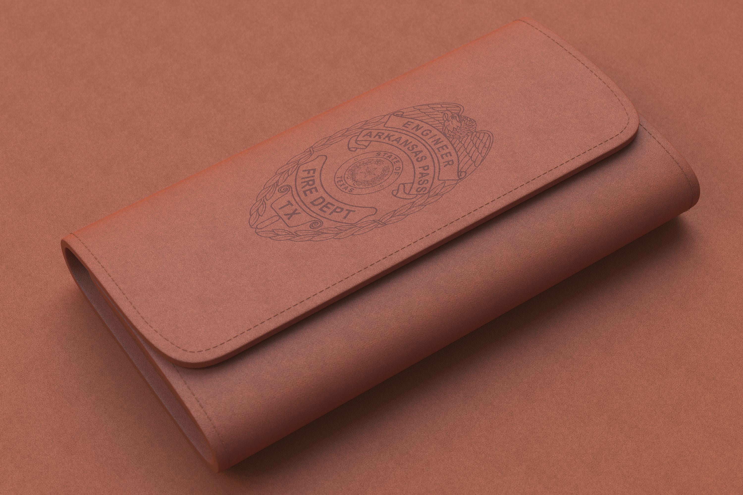 Brown leather wallet with embossed logo on a matching brown background
leather wallet mockup
texas fire dept. badge
