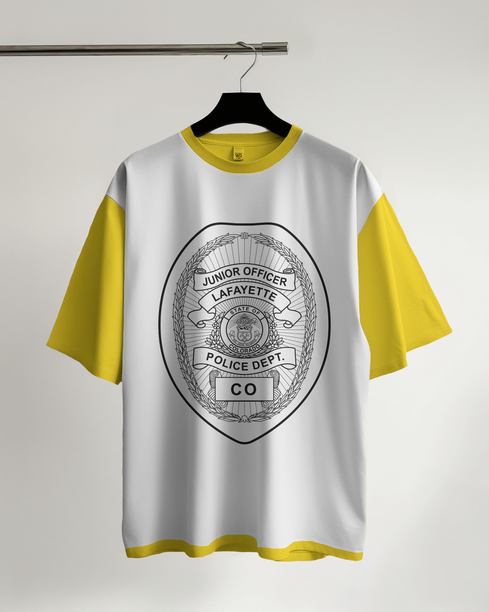 White t-shirt with yellow sleeves featuring a police department logo 