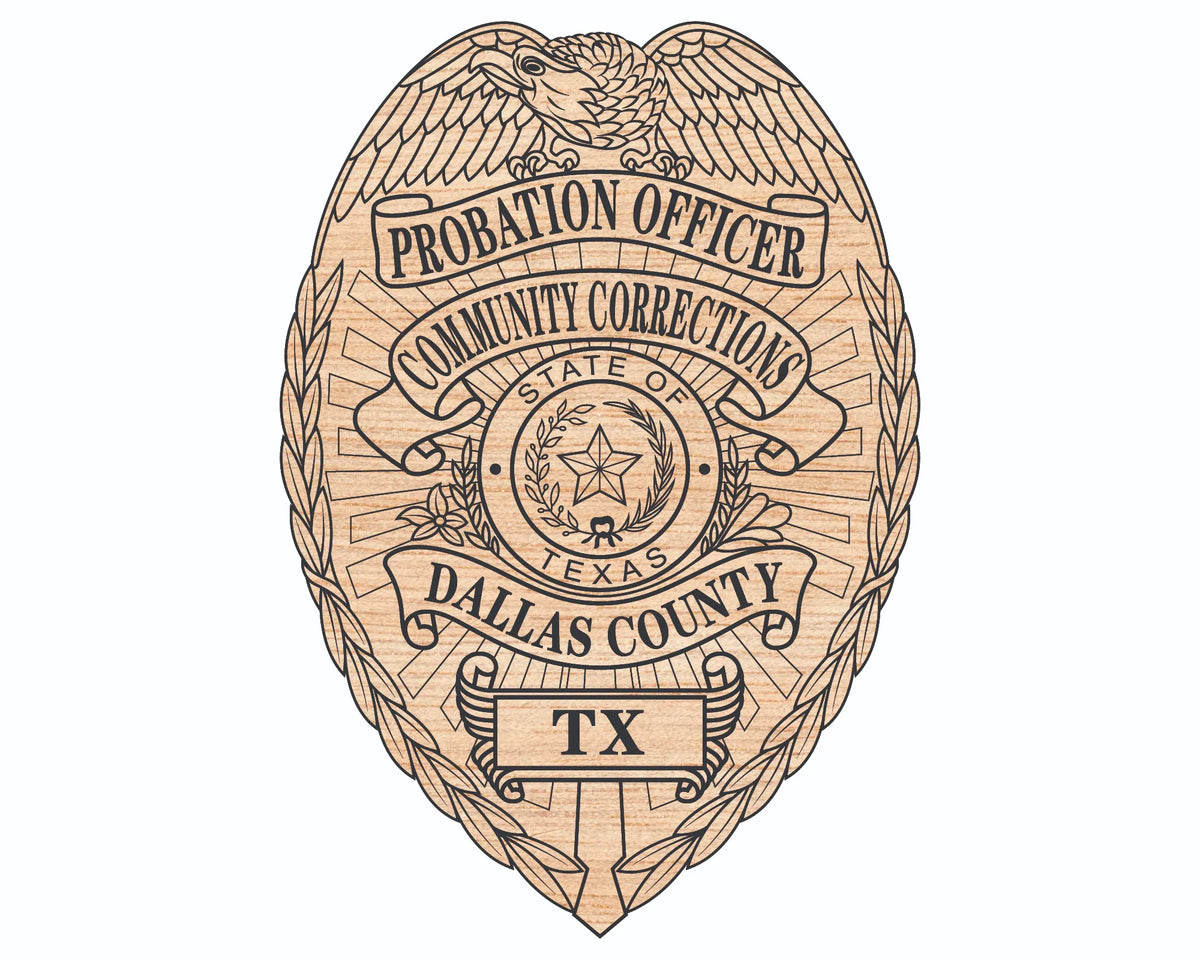 A wooden or wood-look badge shaped like a traditional probation officer badge, featuring an eagle, laurel wreath, and text reading 'PROBATION OFFICER', 'COMMUNITY CORRECTIONS', 'STATE OF TEXAS', 'DALLAS COUNTY', and 'TX'.